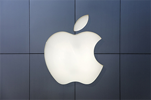 Apple logo sign on dark grey background