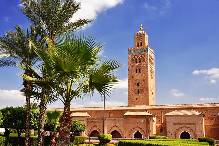 Kutubiyya Mosque, which is the largest morsque in the Marrakesh, located in the southwest medina quarter. The minaret tower has a main shaft and a secondary tower above it with a dome, and a finial of four orbs.