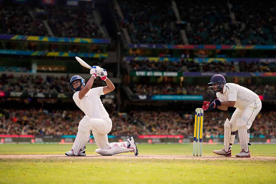 Cricket player on one knee after batting