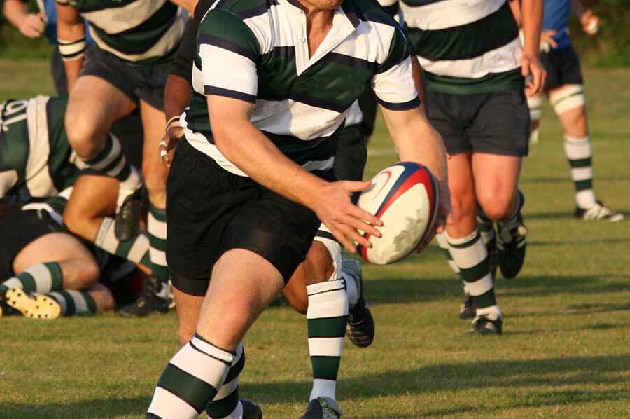 Rugby player running with the ball