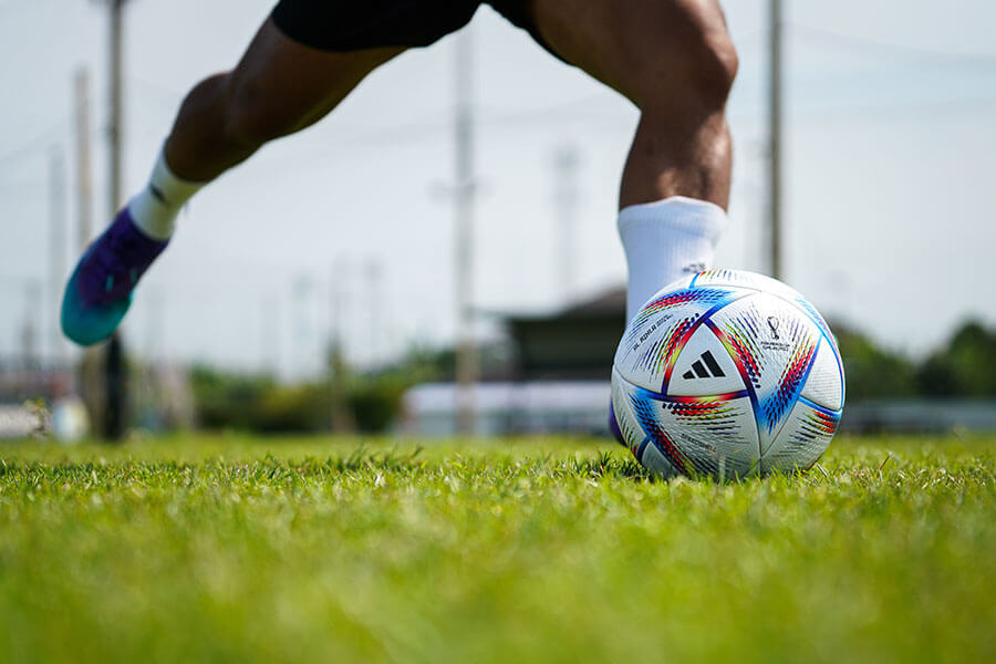 Legs preparing to kick a football