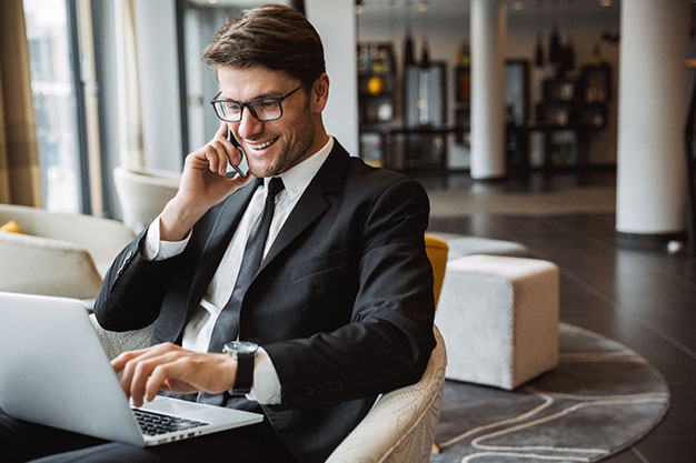 Financial Adviser on the phone smiling