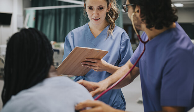 Young nurses examining a patient