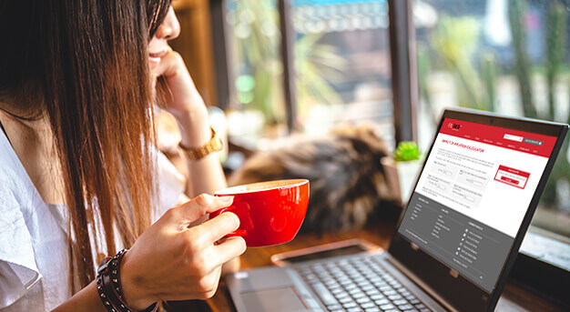 Woman at laptop looking at the impact of inflation