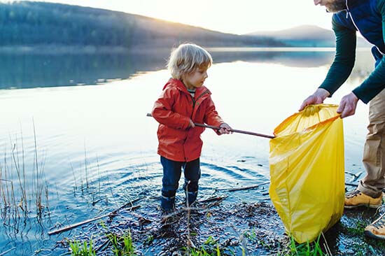 Child collecting rubbish image