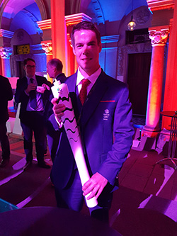 With replica Olympic Torch