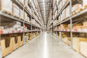 Amazon factory view on the warehouse floor lots of packages stacked high