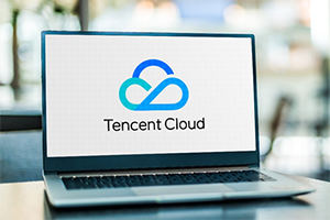 Laptop on a desk with Tencent cloud logo on screen