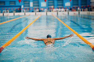 Swimmer doing breast stroke in a swimming pool