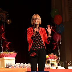Dot Tilbury on stage at a presentation