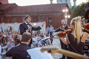 Beethoven Festival- Violins and conductor play open air to a large crowd