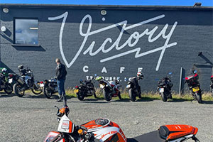 External shot of Victory Cafe with motorbikes in the front