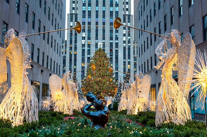 presumably newyork lights, theres christmas tree, fairy lights and some angel statues.